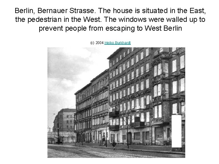 Berlin, Bernauer Strasse. The house is situated in the East, the pedestrian in the