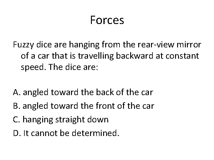 Forces Fuzzy dice are hanging from the rear-view mirror of a car that is