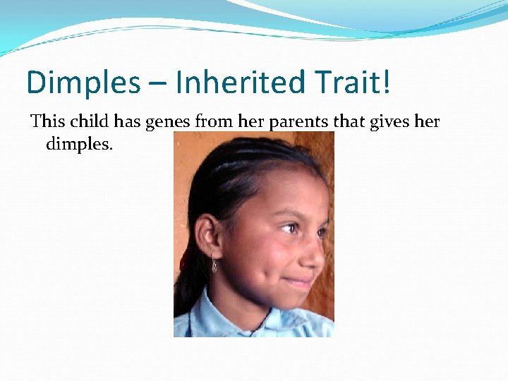 Dimples – Inherited Trait! This child has genes from her parents that gives her