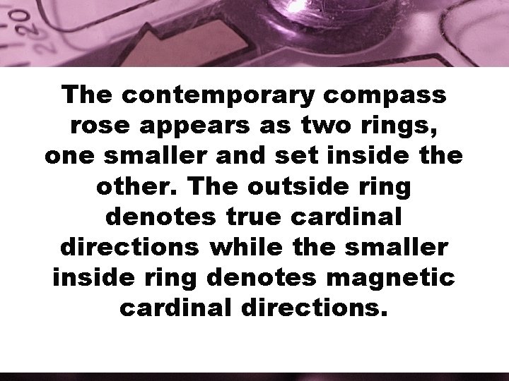 The contemporary compass rose appears as two rings, one smaller and set inside the