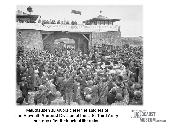 Mauthausen survivors cheer the soldiers of the Eleventh Armored Division of the U. S.
