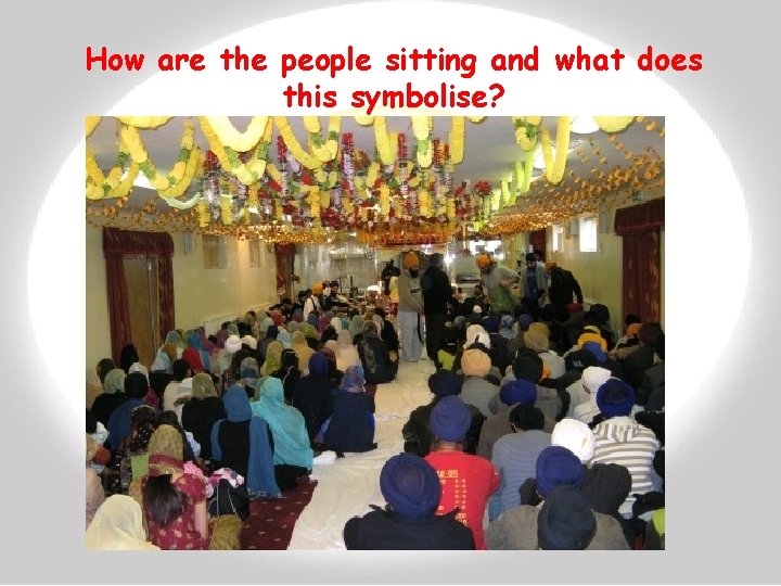 How are the people sitting and what does this symbolise? 