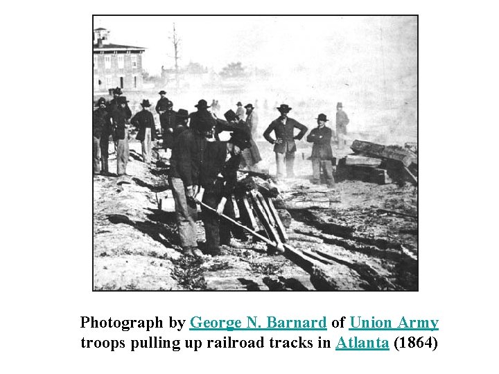 Photograph by George N. Barnard of Union Army troops pulling up railroad tracks in