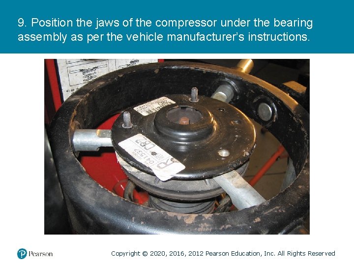 9. Position the jaws of the compressor under the bearing assembly as per the