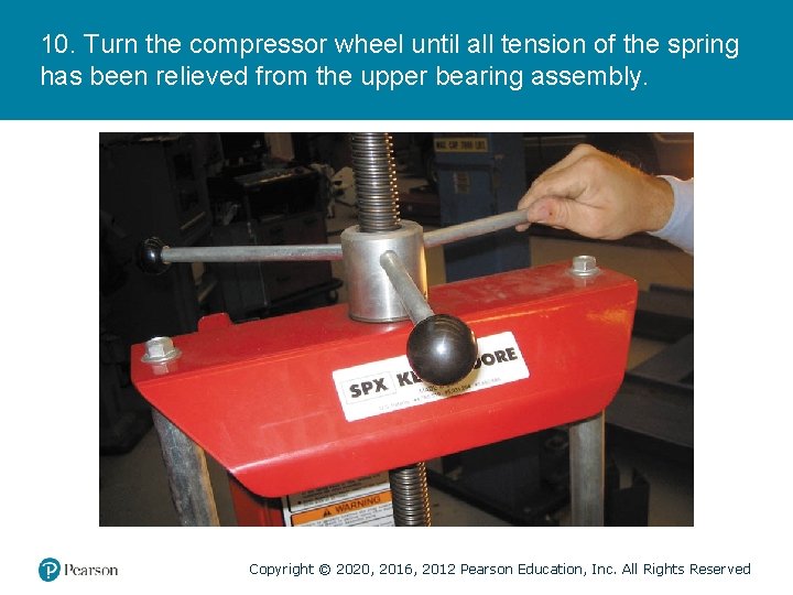 10. Turn the compressor wheel until all tension of the spring has been relieved