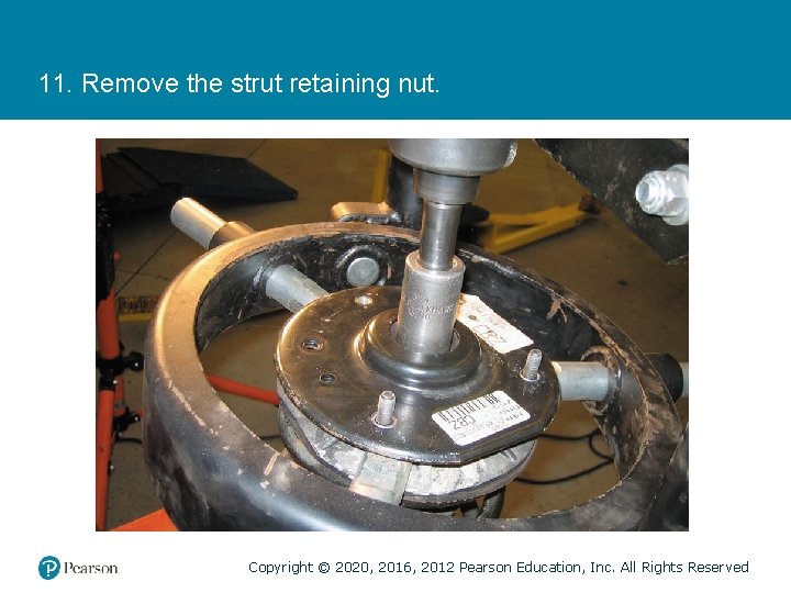 11. Remove the strut retaining nut. Copyright © 2020, 2016, 2012 Pearson Education, Inc.