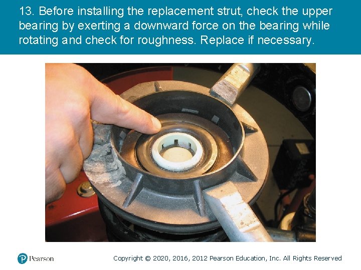 13. Before installing the replacement strut, check the upper bearing by exerting a downward