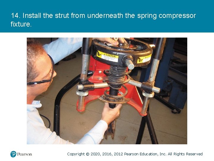 14. Install the strut from underneath the spring compressor fixture. Copyright © 2020, 2016,