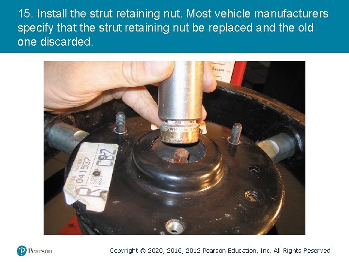 15. Install the strut retaining nut. Most vehicle manufacturers specify that the strut retaining