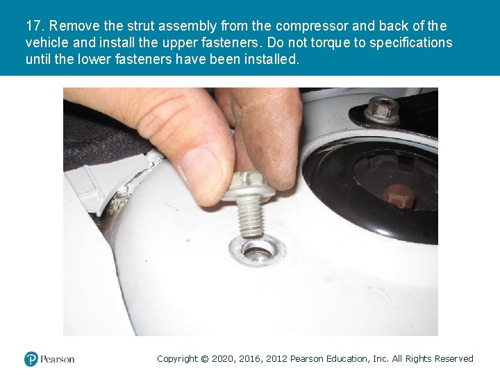 17. Remove the strut assembly from the compressor and back of the vehicle and