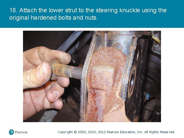 18. Attach the lower strut to the steering knuckle using the original hardened bolts