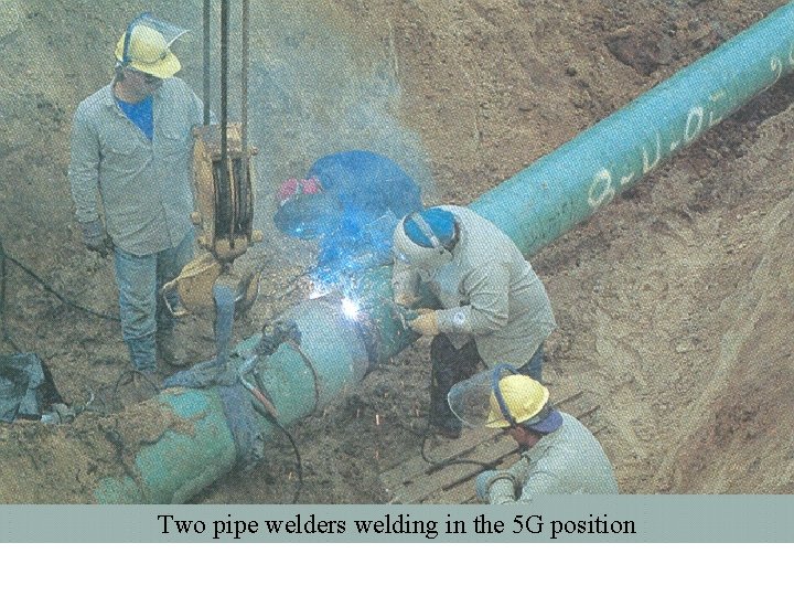 Two pipe welders welding in the 5 G position 