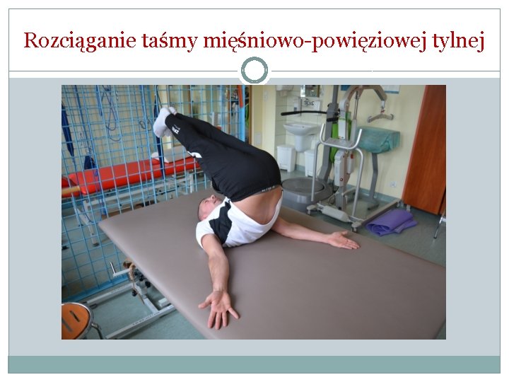 Rozciąganie taśmy mięśniowo-powięziowej tylnej Rozciąganie taśmy mięśniowo-powięziowej tylnej