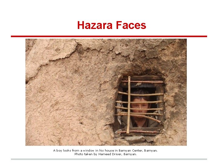 Hazara Faces A boy looks from a window in his house in Bamyan Center,