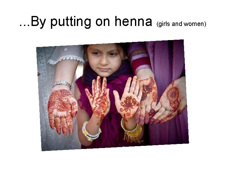 . . . By putting on henna (girls and women) 