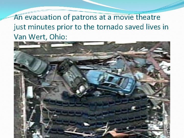 An evacuation of patrons at a movie theatre just minutes prior to the tornado An evacuation of patrons at a movie theatre just minutes prior to the tornado