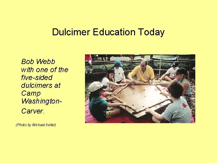 Dulcimer Education Today Bob Webb with one of the five-sided dulcimers at Camp Washington.