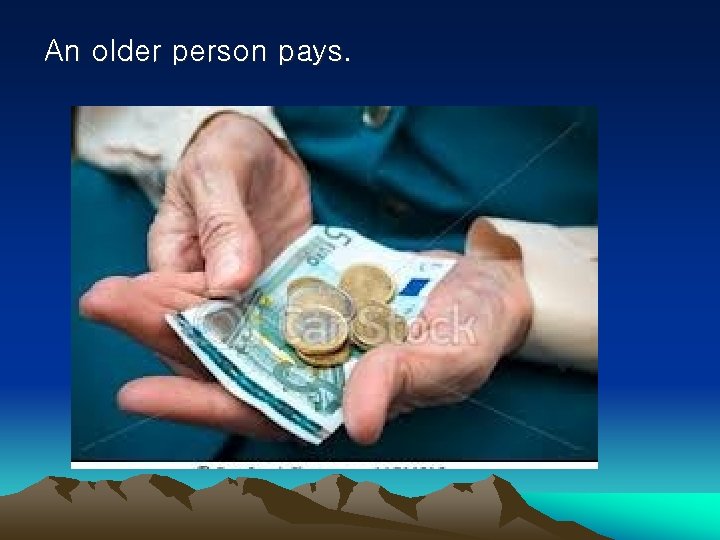 An older person pays. 