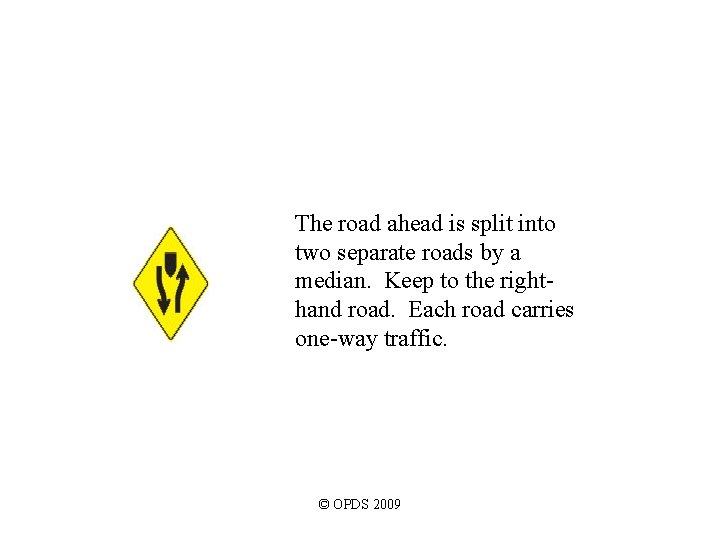 The road ahead is split into two separate roads by a median. Keep to The road ahead is split into two separate roads by a median. Keep to