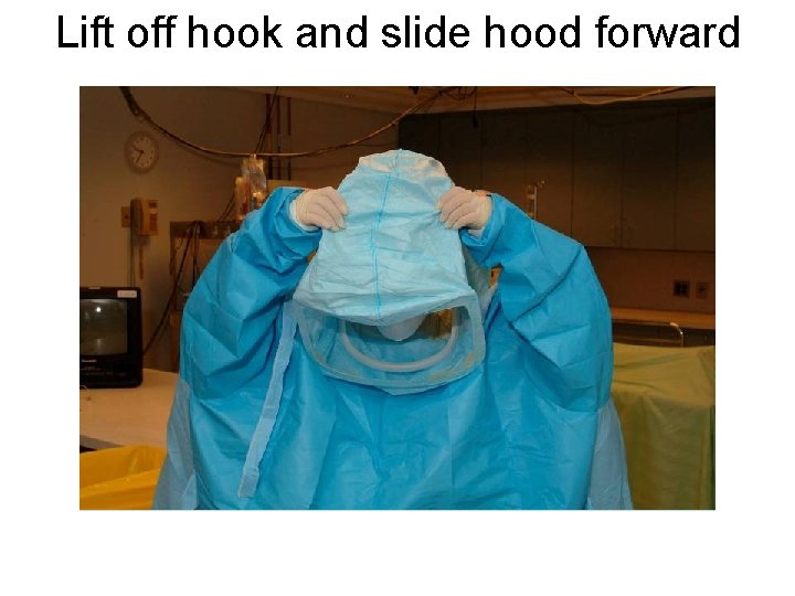 Lift off hook and slide hood forward 