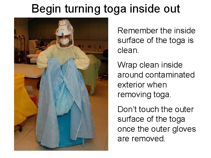 Begin turning toga inside out Remember the inside surface of the toga is clean.