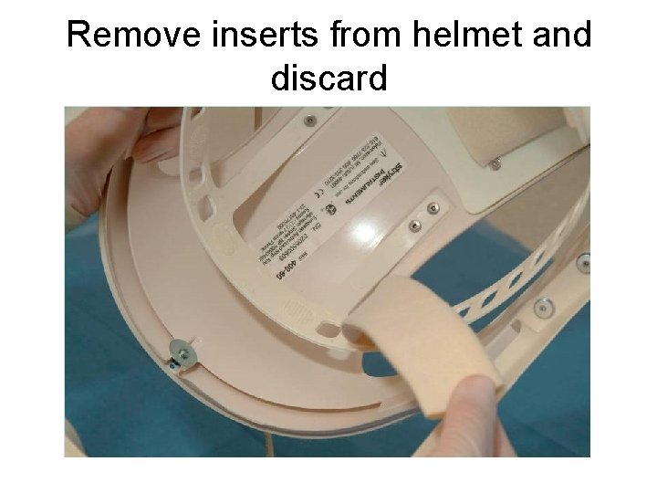 Remove inserts from helmet and discard 