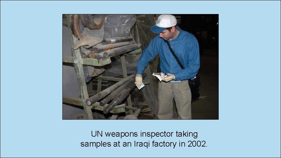 UN weapons inspector taking samples at an Iraqi factory in 2002. 