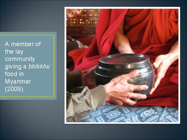 A member of the lay community giving a bhikkhu food in Myanmar (2009). 