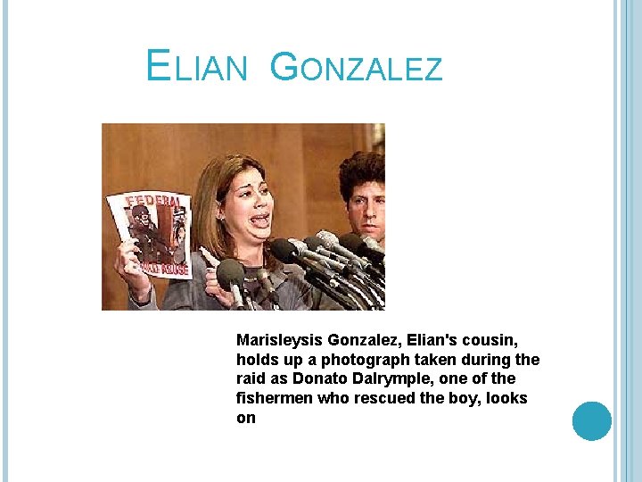 ELIAN GONZALEZ Marisleysis Gonzalez, Elian's cousin, holds up a photograph taken during the raid