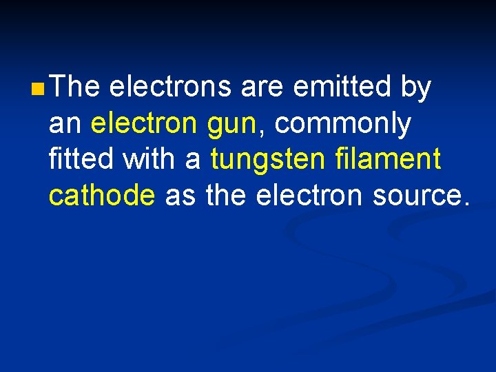 n The electrons are emitted by an electron gun, commonly fitted with a tungsten