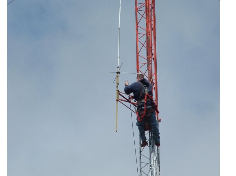 Professional climber changing coax 