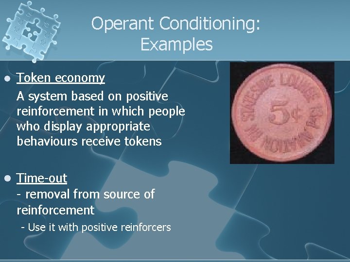 Operant Conditioning: Examples l Token economy A system based on positive reinforcement in which