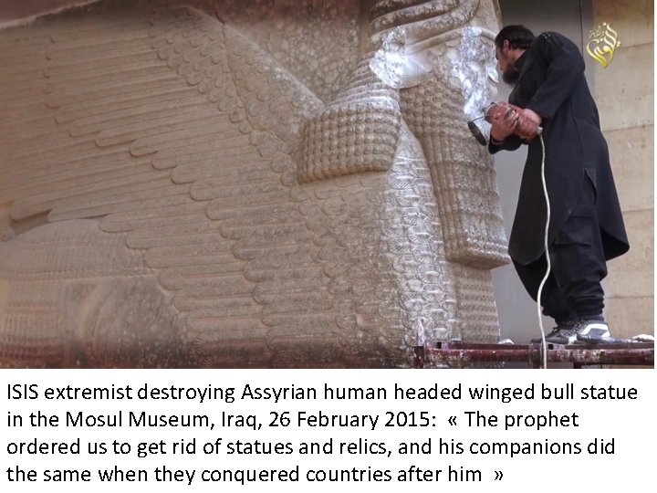 ISIS extremist destroying Assyrian human headed winged bull statue in the Mosul Museum, Iraq,