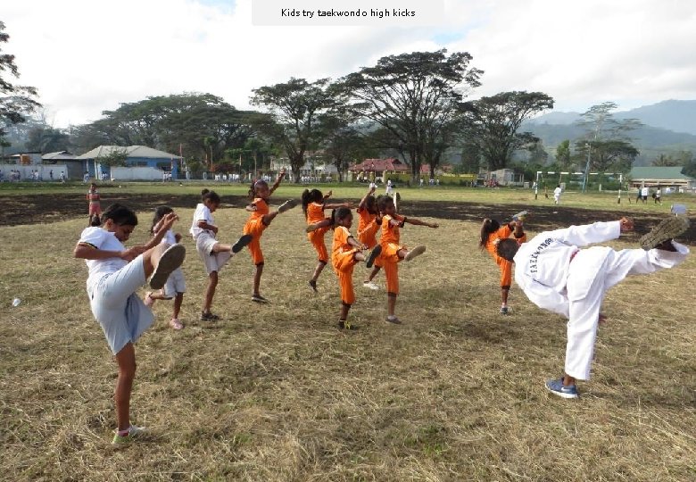 Kids try taekwondo high kicks 