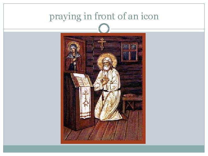 praying in front of an icon praying in front of an icon