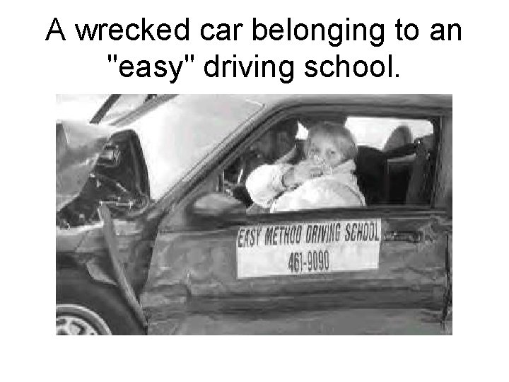 A wrecked car belonging to an "easy" driving school. 