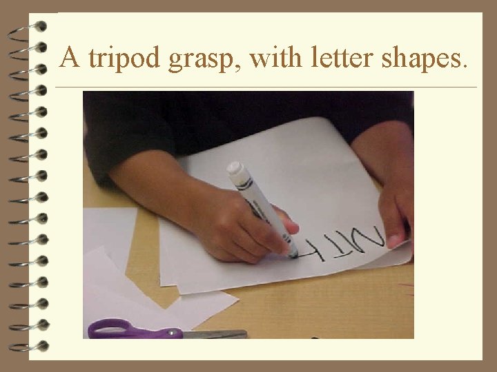 A tripod grasp, with letter shapes. 