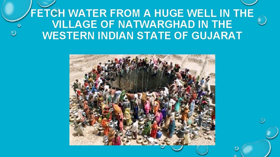 FETCH WATER FROM A HUGE WELL IN THE VILLAGE OF NATWARGHAD IN THE WESTERN