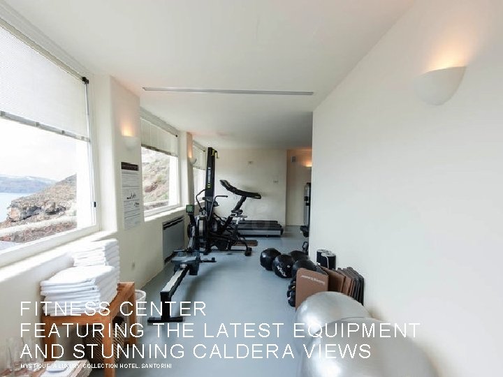 FITNESS CENTER FEATURING THE LATEST EQUIPMENT AND STUNNING CALDERA VIEWS MYSTIQUE, A LUXURY COLLECTION