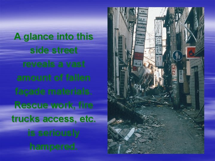 A glance into this side street reveals a vast amount of fallen façade materials.