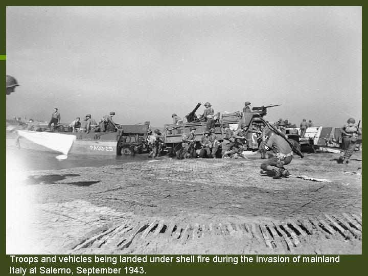Troops and vehicles being landed under shell fire during the invasion of mainland Italy Troops and vehicles being landed under shell fire during the invasion of mainland Italy
