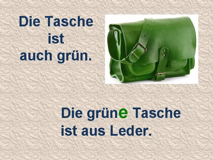 Die Tasche ist auch grün. Die grüne Tasche ist aus Leder. 