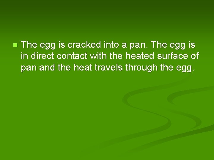 n The egg is cracked into a pan. The egg is in direct contact