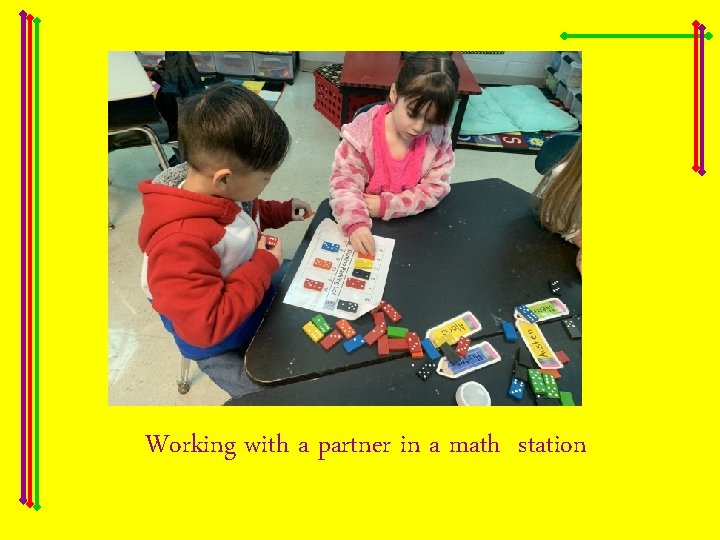 Working with a partner in a math station 