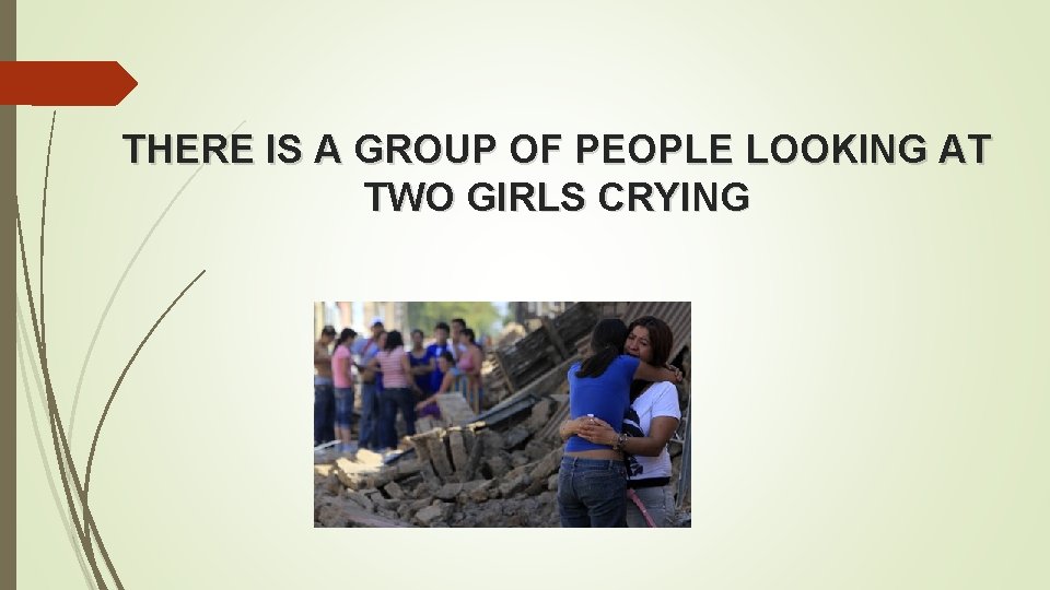 THERE IS A GROUP OF PEOPLE LOOKING AT TWO GIRLS CRYING 