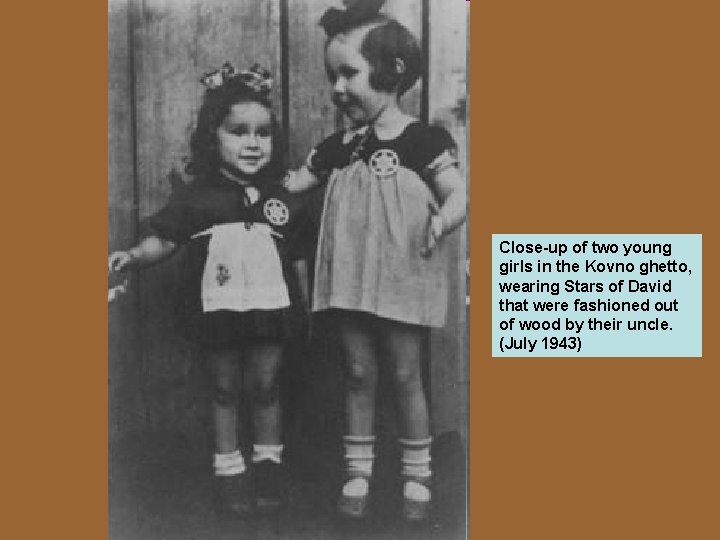 Close-up of two young girls in the Kovno ghetto, wearing Stars of David that