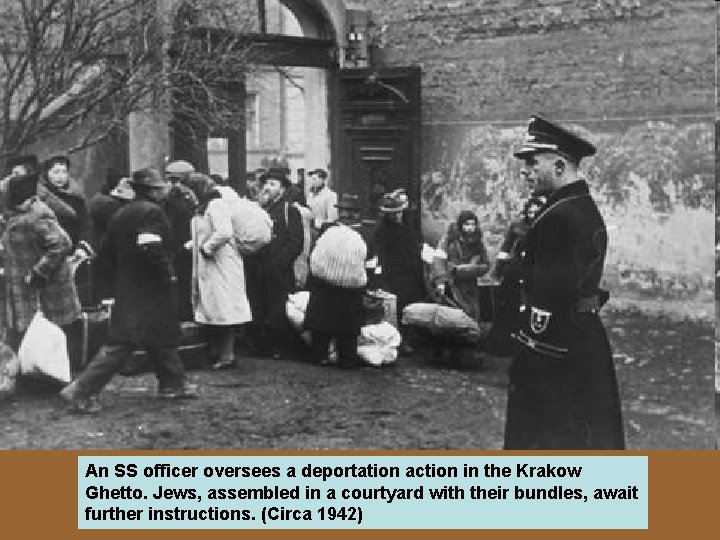 An SS officer oversees a deportation action in the Krakow Ghetto. Jews, assembled in