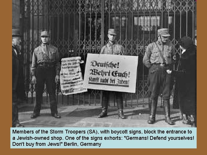 Members of the Storm Troopers (SA), with boycott signs, block the entrance to a