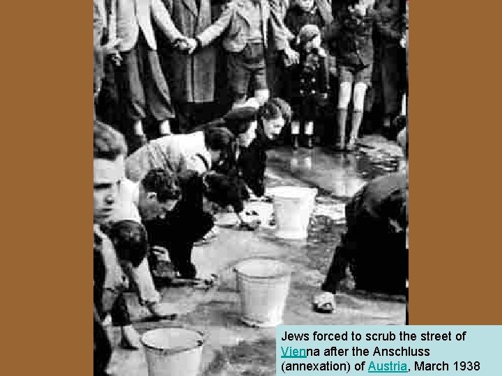 Jews forced to scrub the street of Vienna after the Anschluss (annexation) of Austria,