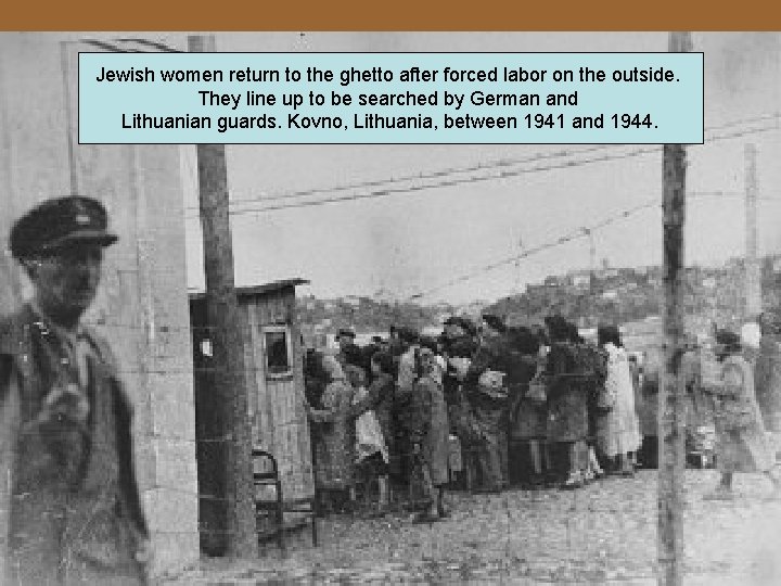Jewish women return to the ghetto after forced labor on the outside. They line